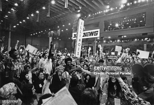 American civil rights activist, Jesse Jackson Sr. And delegates from Illinois at the Democratic National Convention, held at Miami Beach Convention...