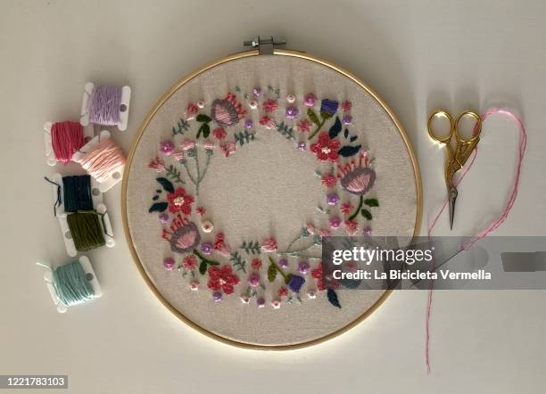 flower embroidery on frame - embroidery stock pictures, royalty-free photos & images