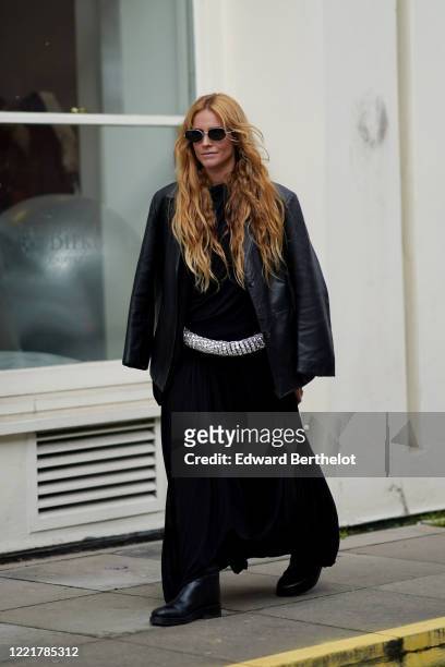 Blanca Miro wears a black leather jacket, a black dress, black leather boots, during London Fashion Week February 2020 on February 17, 2020 in...