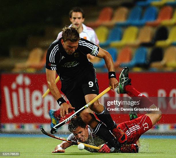 Moritz Fuerste of Germany is challenged by Iain Mackay of England during the Men's Eurohockey 2011 semi final match between Germany and England at...
