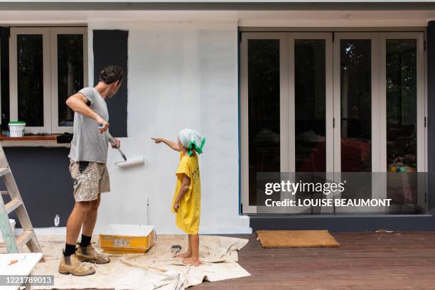 painting our home - home renovations australia stock pictures, royalty-free photos & images