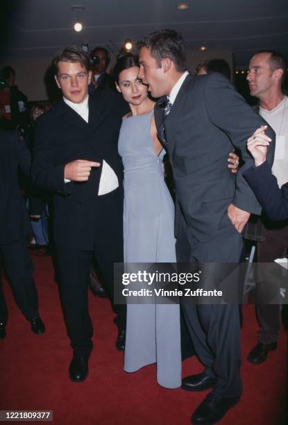 American actor Matt Damon, British actress Minnie Driver, and American actor Ben Affleck attend the premiere of 'Good Will Hunting' at the Mann Bruin...