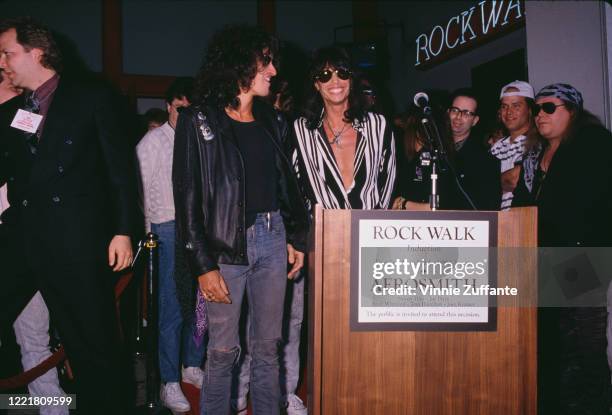 American guitarist Joe Perry and American singer Steven Tyler attend the RockWalk induction ceremony for their band Aerosmith, at the Guitar Center...