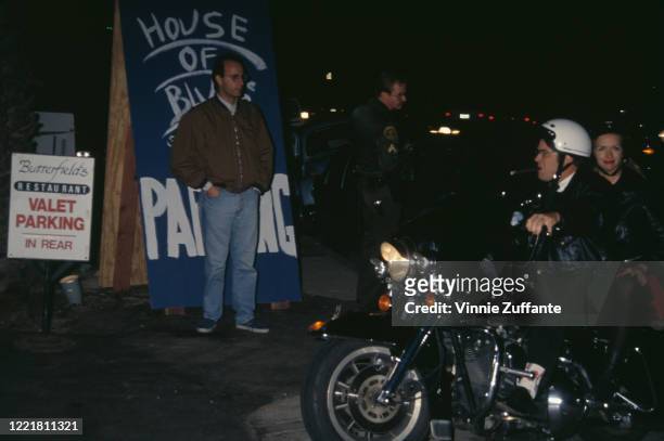 Canadian actor and comedian Dan Aykroyd and his wife, American actress Donna Dixon arrive by motorcycle at the parking lot for The House of Blues,...