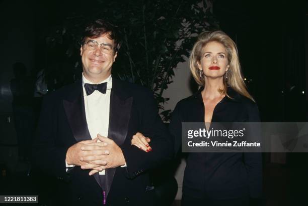 Canadian actor and comedian Dan Aykroyd and his wife, American actress Donna Dixon attend an event, circa 1995.