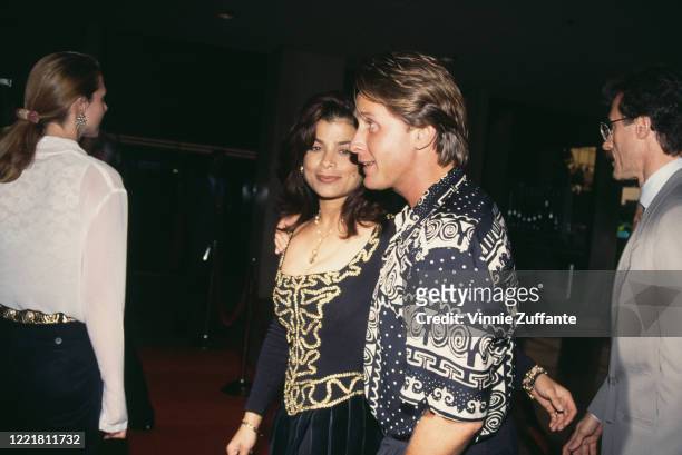 American singer and dancer Paula Abdul and her husband, American actor Emilio Estevez attend the premiere of 'Sleepless in Seattle', held at the...