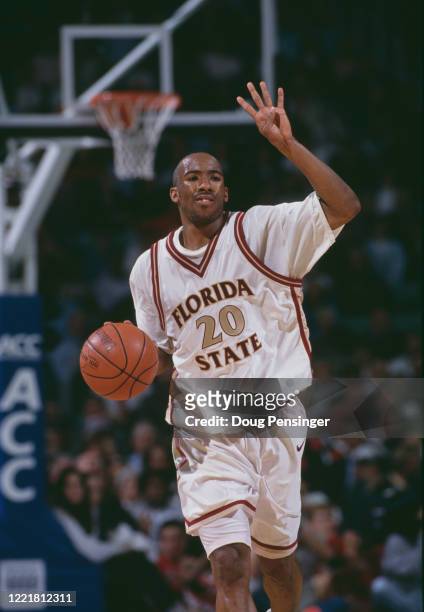 LaMarr Greer, Guard for the Florida State Seminoles hand signals the play during the NCAA Atlantic Coast Conference tournament college basketball...