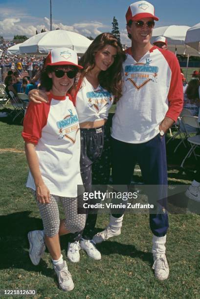 American actress Rhea Perlman, American actress Kirstie Alley and American actor Ted Danson attend Narconon's 1991 Celebrity Softball Game, held at...