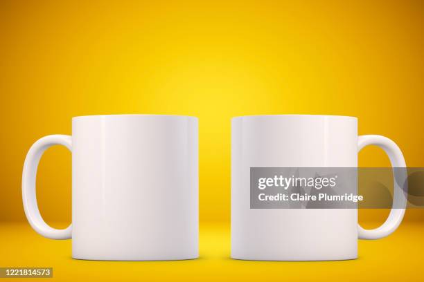 two white mugs mockup on a yellow background. perfect for businesses selling mugs, just overlay your quote or design on to the image. - mug mockup stock pictures, royalty-free photos & images