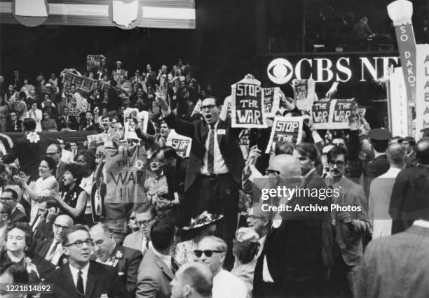 New York delegates holding 'stop the war' banners in protest at the USA's continued involvement in the Vietnam War, on the third day of the 1968...