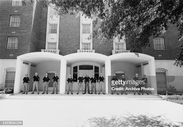 State troopers and deputies stand at the entrance to a University of Alabama building on the day George Wallace, Governor of Alabama, had said he...