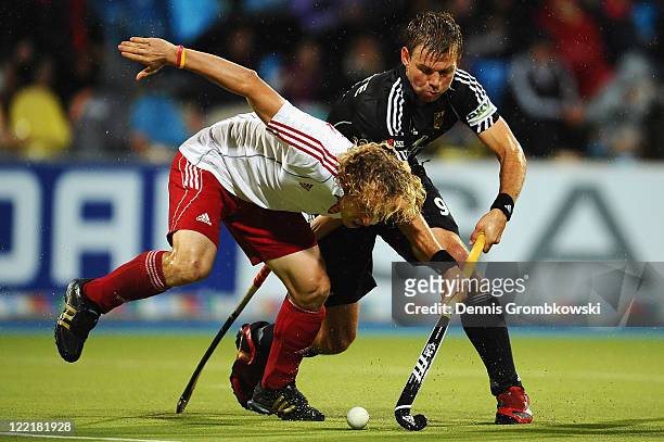 Richard Alexander of England challenges Moritz Fuerste of Germany during the Men's Eurohockey 2011 semi final match between Germany and England at...