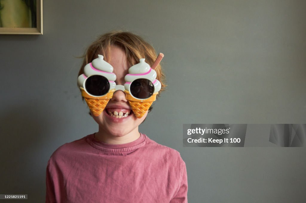 Boy wearing novelty sunglasses
