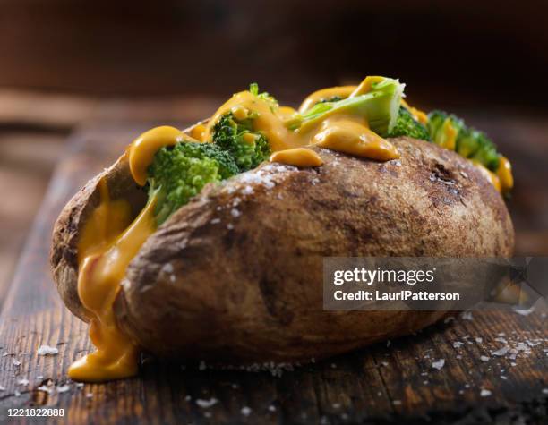 cheese and broccoli stuffed potatoes - stuffed potato stock pictures, royalty-free photos & images