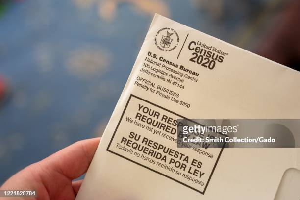 Close-up of human hand holding a letter from the Census Bureau regarding the 2020 Census, San Ramon, California, April 24, 2020.