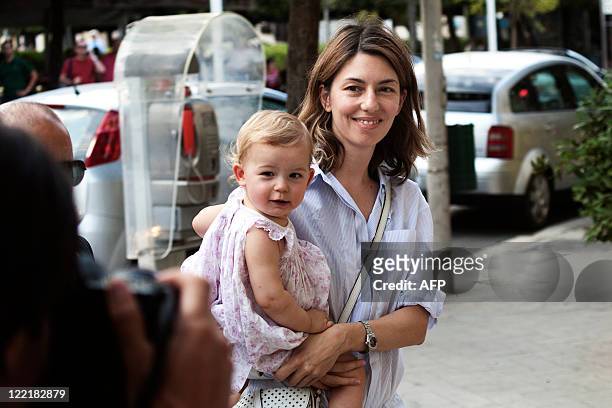 Movie director Sofia Coppola walks along a street in Bernalda, a small city in southern Italy, with her daughter, on August, 26 2011, the eve of her...