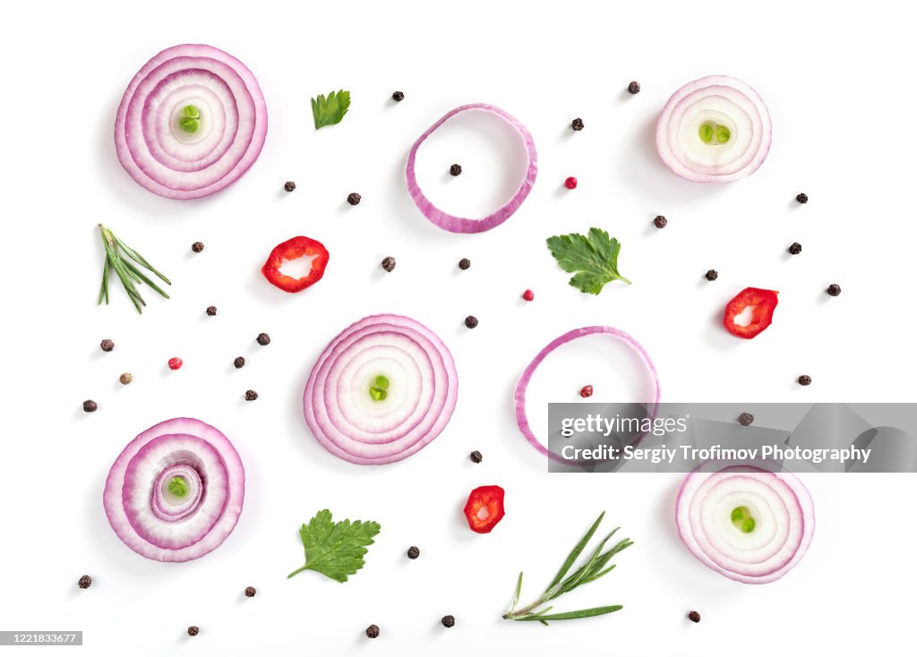 Red Onion Slices with Pepper corns and Herbs on white background