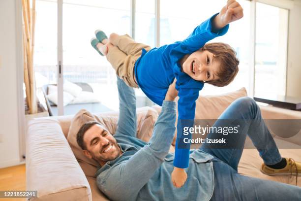 excited father and son enjoying time together during lockdown - family with one child stock pictures, royalty-free photos & images