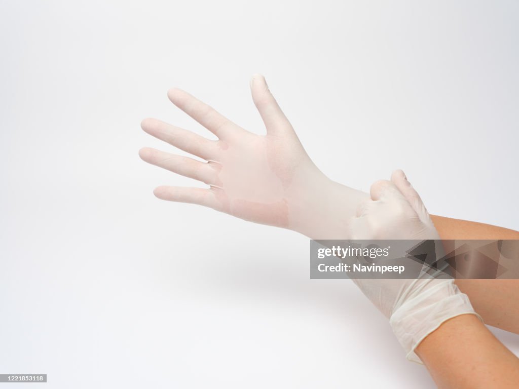 Putting On Plastic Glove
