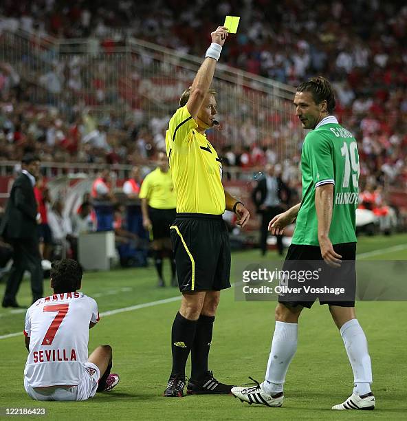Yellow Card for Hannover 96 Player Christina Schulz after the foul on Jesus Navas during the UEFA Europa League Play-Off second leg match between FC...