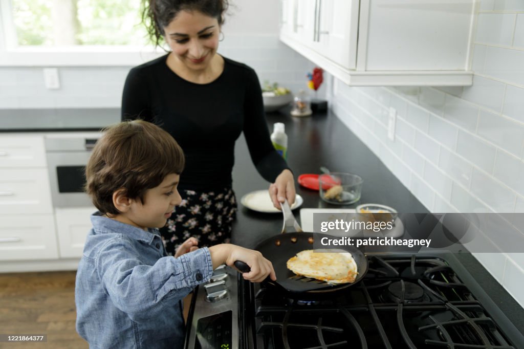 Little Boy Learns to Cook