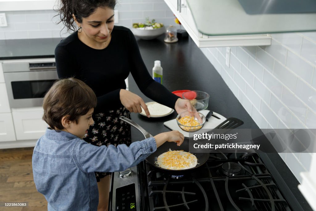 Little Boy Learns to Cook