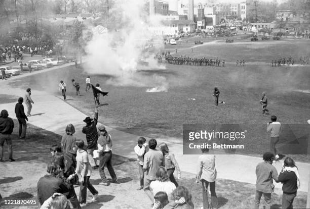 Students disperse as National Guardsmen fire tear gas into a crowd on the commons.