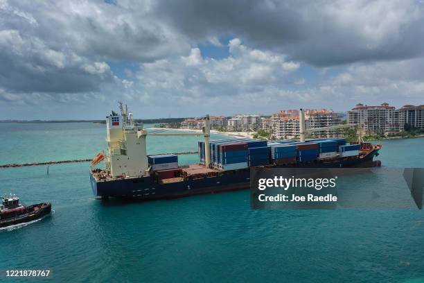 In this aerial photo from a drone, the AS Savanna cargo ship prepares to pull into PortMiami on April 29, 2020 in Miami, Florida. The government...