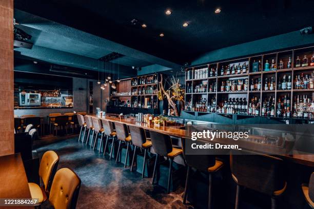 modern empty cafe or night club, closed down during pandemic lockdown - bar counter stock pictures, royalty-free photos & images