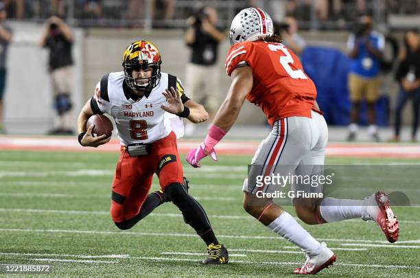Caleb Henderson of the Maryland Terrapins is tackled by Chase Young of the Ohio State Buckeyes at Ohio Stadium on October 7, 2017 in Columbus, Ohio.