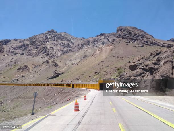 tunnel on a road in the the andes, andes mountains, andean mountains or cordillera de los andes - mount aconcagua stock pictures, royalty-free photos & images