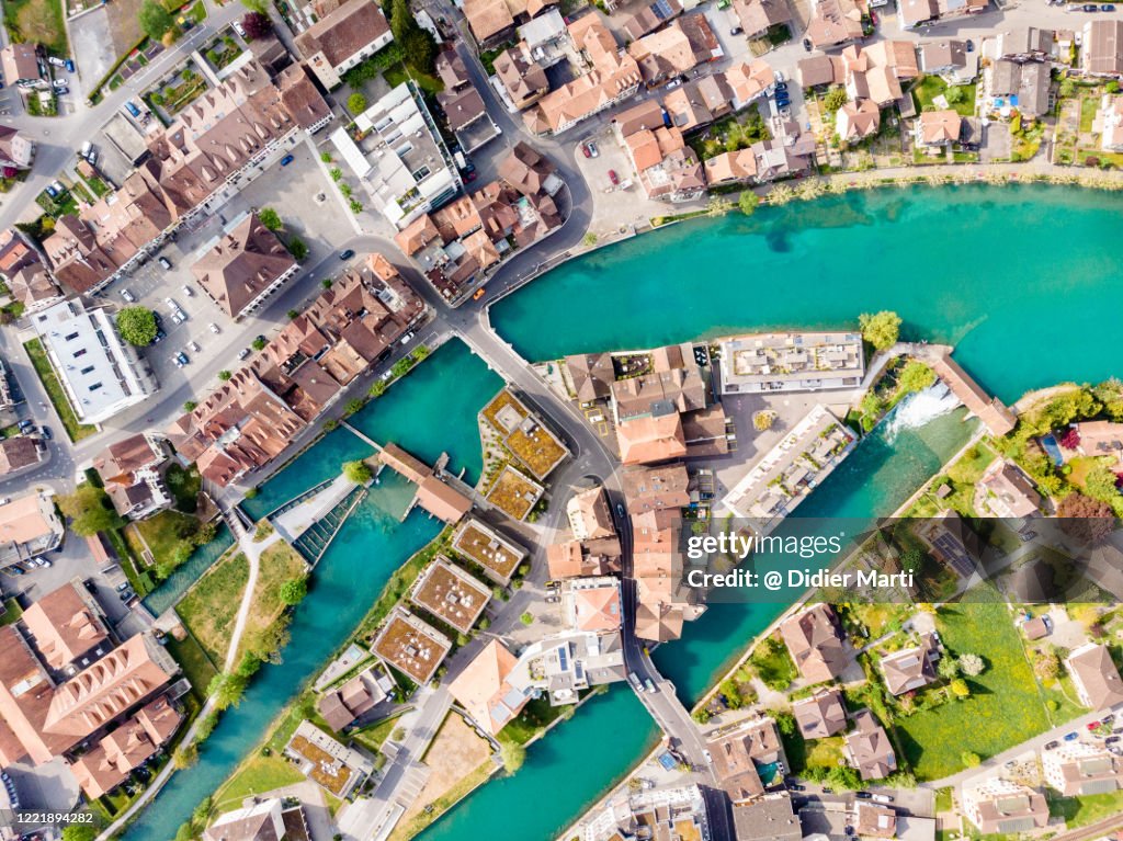 Top down view of the Interlaken city with the Aar river flowing by the old town in Canton Bern in Switzerland.