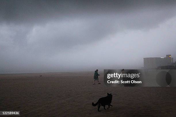 Wind and rain from Hurricane Irene chase visitors off the beach August 26, 2011 in Nags Head, North Carolina. Dare County, which includes the...