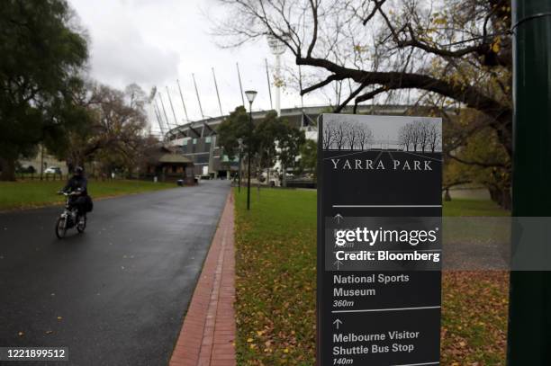 Cyclist rides through Yarra Park near the Melbourne Cricket Ground in Melbourne, Victoria, Australia, on Monday, Jun 22, 2020. Australia's...