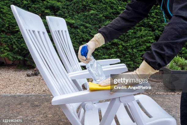 wiping down surfaces - garden chairs - garden furniture stock pictures, royalty-free photos & images