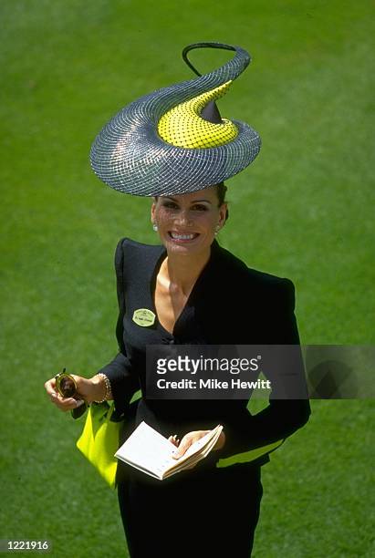 Beautiful lady poses on Ladies Day during the Royal Ascot Race Meeting held at Ascot Racecourse in Ascot, England. \ Mandatory Credit: Mike Hewitt...