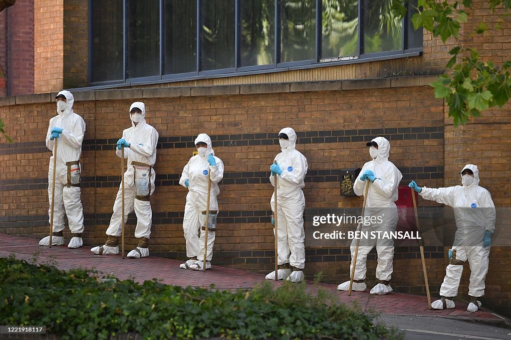Ppe In Police Police forensics officers dressed in Tyvek protective PPE suits and ...