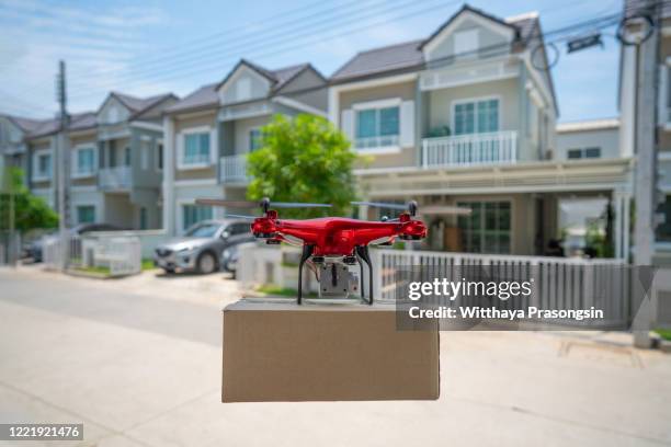 drone parcel delivery - drone parcel stock pictures, royalty-free photos & images