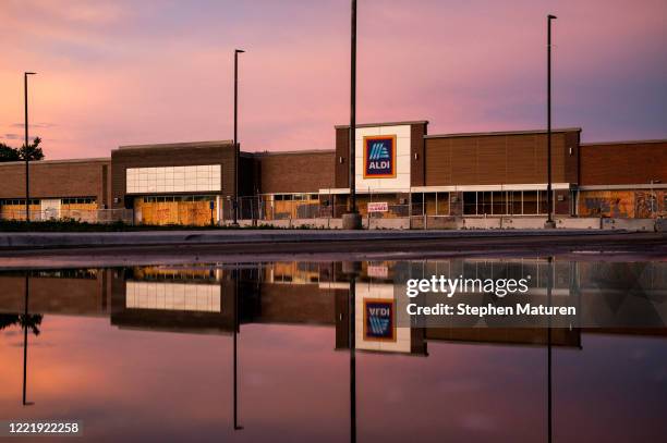 An Aldi grocery store is boarded up and closed near the Third Police Precinct Station on June 21, 2020 in Minneapolis, Minnesota. Over 1500 buildings...