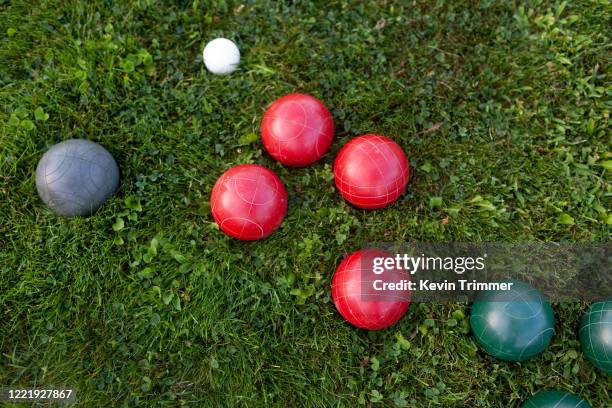 bocce ball game on grass - bocce ball stock pictures, royalty-free photos & images