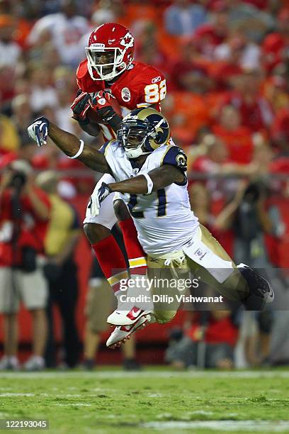 Dwayne Bowe of the Kansas City Chiefs hauls in a pass against Quintin Mikell of the St. Louis Rams during a pre-season game at Arrowhead Stadium on...