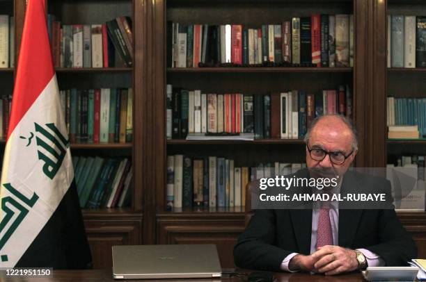 Iraq's Minister of Finance Ali Allawi listens during an interview at his residence in the capital Baghdad, on June 22, 2020.