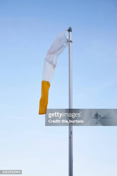 windsock against blue sky - windsock stock pictures, royalty-free photos & images