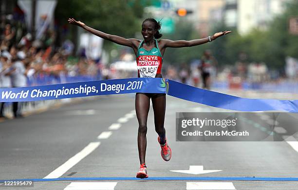 Edna Ngeringwony Kiplagat of Kenya celebrates winning the women's marathon during day one of 13th IAAF World Athletics Championships at the Daegu...