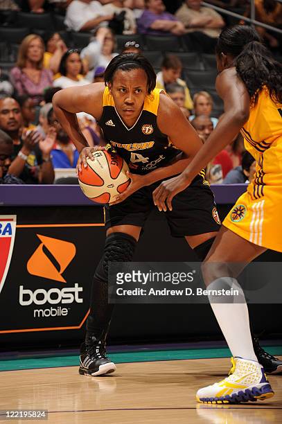 Amber Holt of the Tulsa Shock holds the ball in a game against the Los Angeles Sparks at Staples Center on August 26, 2011 in Los Angeles,...