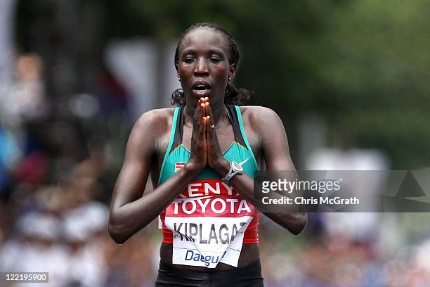 Edna Ngeringwony Kiplagat of Kenya celebrates winning the women's marathon during day one of 13th IAAF World Athletics Championships at the Daegu...