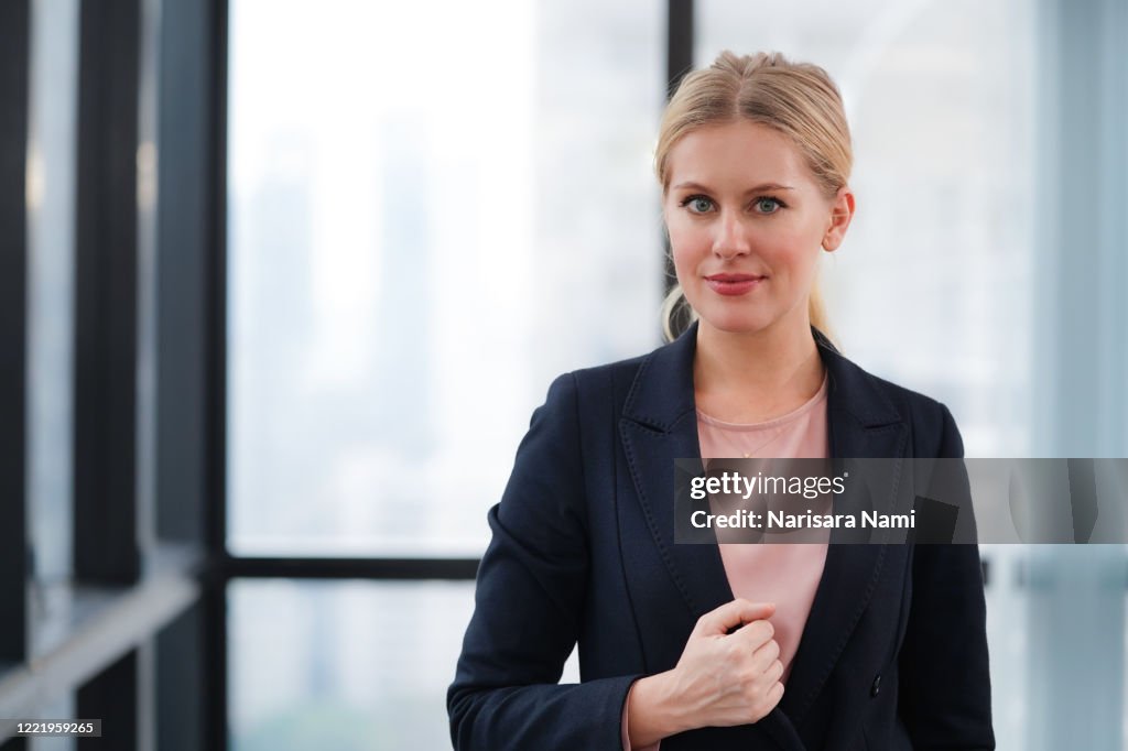 Senior businesswoman standing in the office. attractive business girl with a smart look.