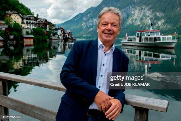 The Mayor of Hallstatt village, Alexander Scheutz poses in front of of Lake Hallstatt's western shore in Austria's mountainous Salzkammergut region...