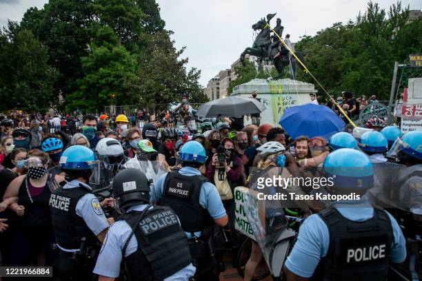 Protesters clash with U.S. Park Police after protesters attempted to pull down the statue of Andrew Jackson in Lafayette Square near the White House...