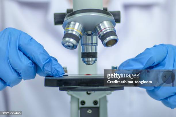 microscope during research - chemistry macro stock-fotos und bilder